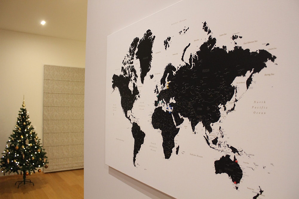 world map with pins black and white